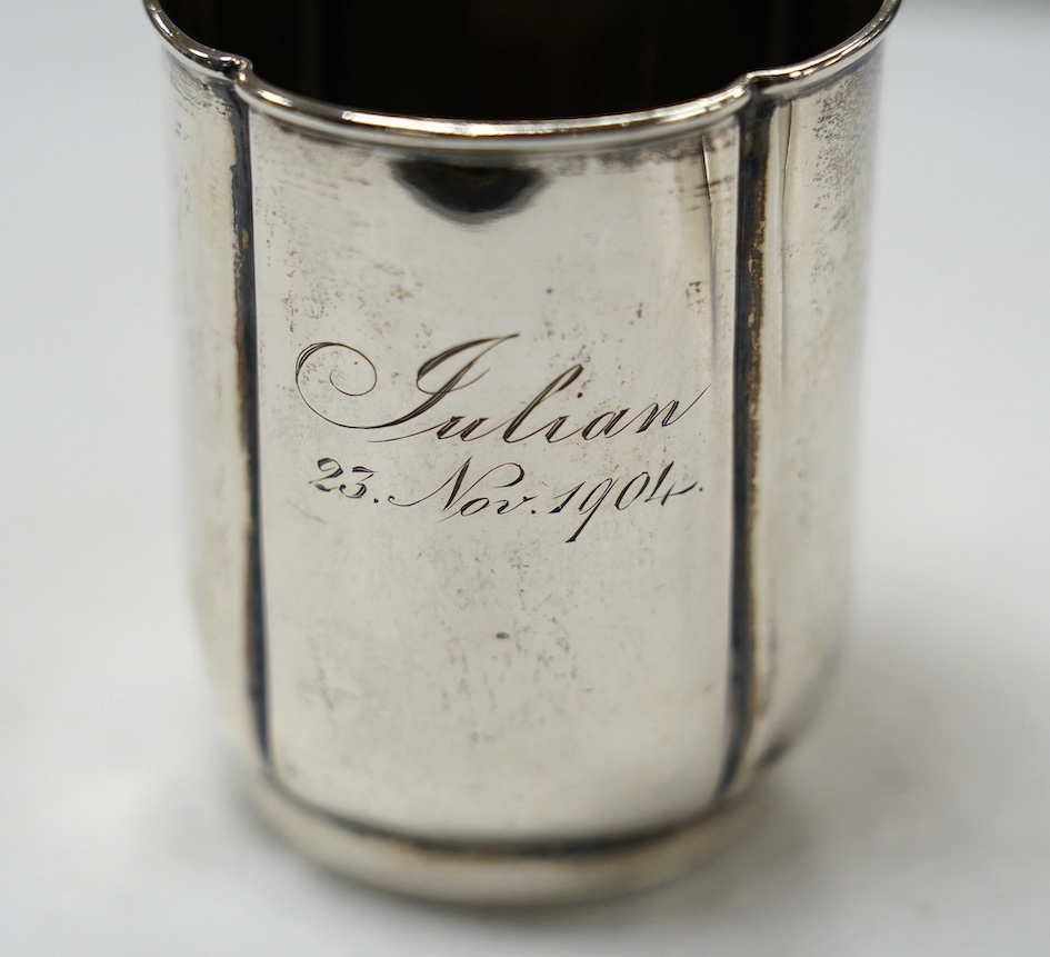 A George V silver mug, by Walker & Hall, Sheffield, 1936, 88mm, together with an earlier silver christening mug, 10.1oz. Condition - fair